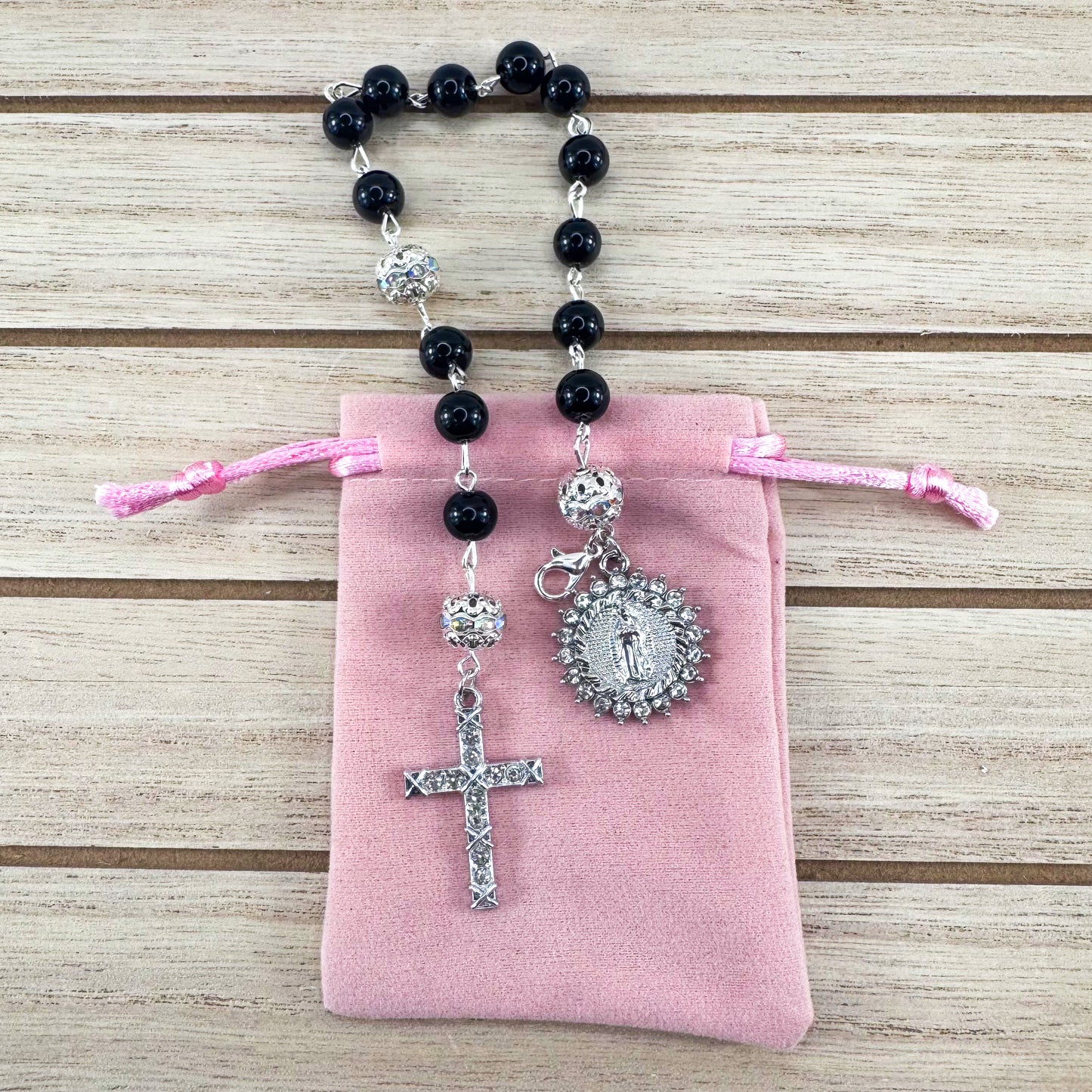 Luxury Catholic rosary bracelet handcrafted with natural black onyx gemstone beads, a silver-tone cross with zirconia accents, and a Lady of Guadalupe medal. Adjustable beaded bracelet perfect for prayer, religious gifts, Confirmation, bridesmaid gifts, or everyday devotion. Made in Edmonton, AB, Canada.