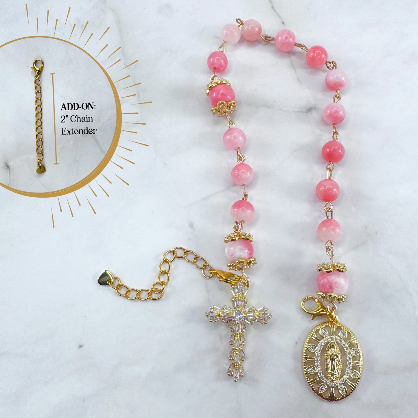 Luxury Catholic rosary bracelet handcrafted with natural pink persian jade gemstone beads, a gold-tone cross with zirconia accents, and a Lady of Guadalupe medal. Adjustable beaded bracelet perfect for prayer, religious gifts, Confirmation, bridesmaid gifts, or everyday devotion. Made in Edmonton, AB, Canada.