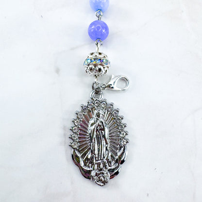 Luxury Catholic rosary bracelet handcrafted with natural Periwinkle Blue Angelite gemstone beads, a silver-tone cross with zirconia accents, and a Lady of Guadalupe medal. Adjustable beaded bracelet perfect for prayer, religious gifts, Confirmation, bridesmaid gifts, or everyday devotion. Made in Edmonton, AB, Canada.