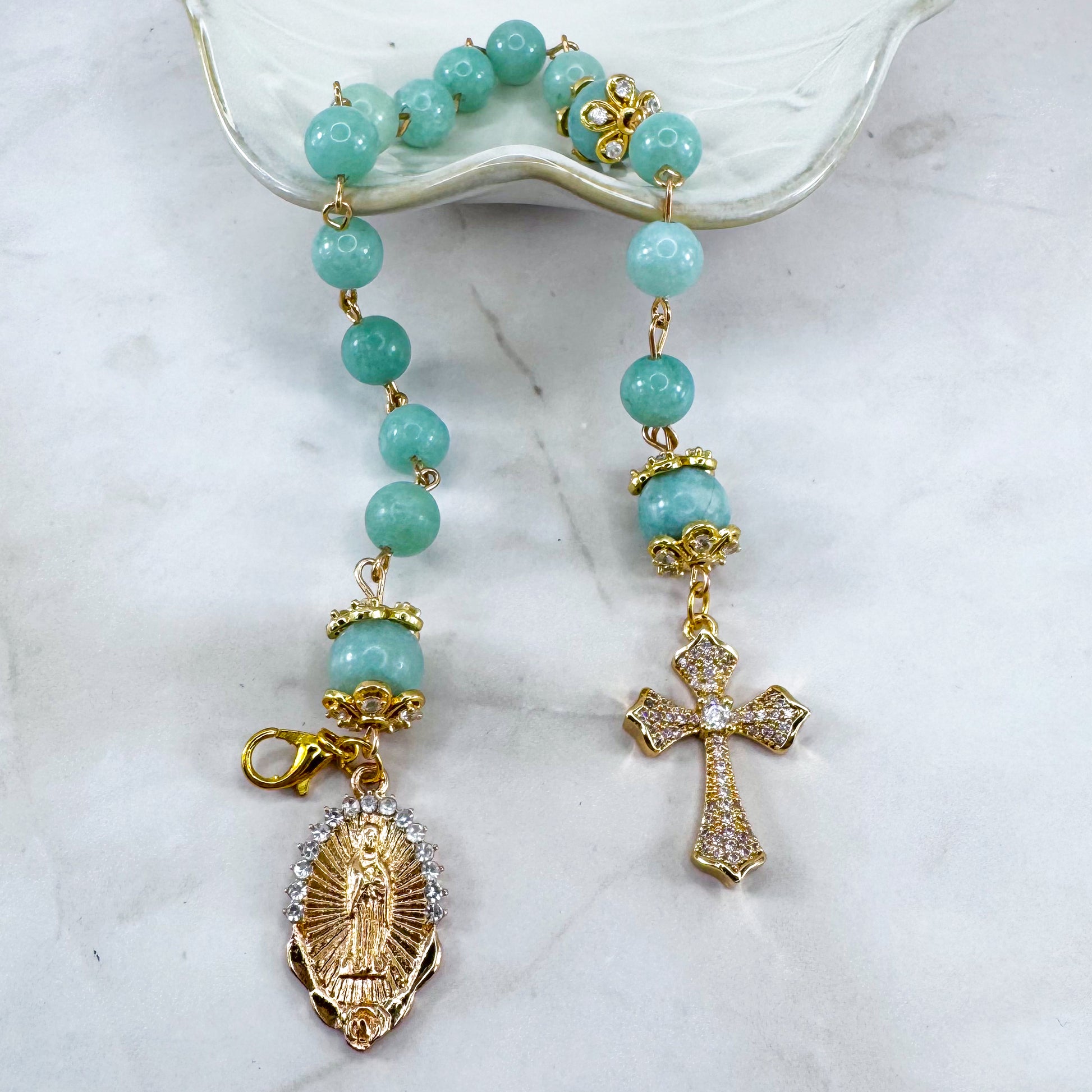 Luxury Catholic rosary bracelet handcrafted with natural Emerald Green Jade gemstone beads, a gold-tone cross with zirconia accents, and a Lady of Guadalupe medal. Adjustable beaded bracelet perfect for prayer, religious gifts, Confirmation, bridesmaid gifts, or everyday devotion. Made in Edmonton, AB, Canada.