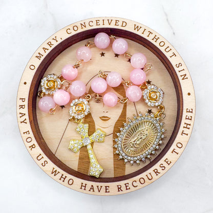Luxury Catholic rosary bracelet handcrafted with natural rose quartz gemstone beads, a gold-tone cross with zirconia accents, and a Lady of Guadalupe medal. Adjustable beaded bracelet perfect for prayer, religious gifts, Confirmation, bridesmaid gifts, or everyday devotion. Made in Edmonton, AB, Canada.
