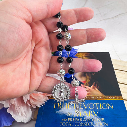 Luxury Catholic rosary bracelet handcrafted with natural black onyx gemstone beads, a silver-tone cross with zirconia accents, and a Lady of Guadalupe medal. Adjustable beaded bracelet perfect for prayer, religious gifts, Confirmation, bridesmaid gifts, or everyday devotion. Made in Edmonton, AB, Canada.
