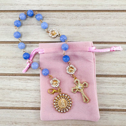 Luxury Catholic rosary bracelet handcrafted with natural blue quartz gemstone beads, a gold-tone cross with zirconia accents, and a Lady of Guadalupe medal. Adjustable beaded bracelet perfect for prayer, religious gifts, Confirmation, bridesmaid gifts, or everyday devotion. Made in Edmonton, AB, Canada.