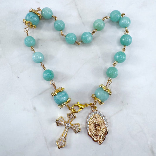 Luxury Catholic rosary bracelet handcrafted with natural Emerald Green Jade gemstone beads, a gold-tone cross with zirconia accents, and a Lady of Guadalupe medal. Adjustable beaded bracelet perfect for prayer, religious gifts, Confirmation, bridesmaid gifts, or everyday devotion. Made in Edmonton, AB, Canada.