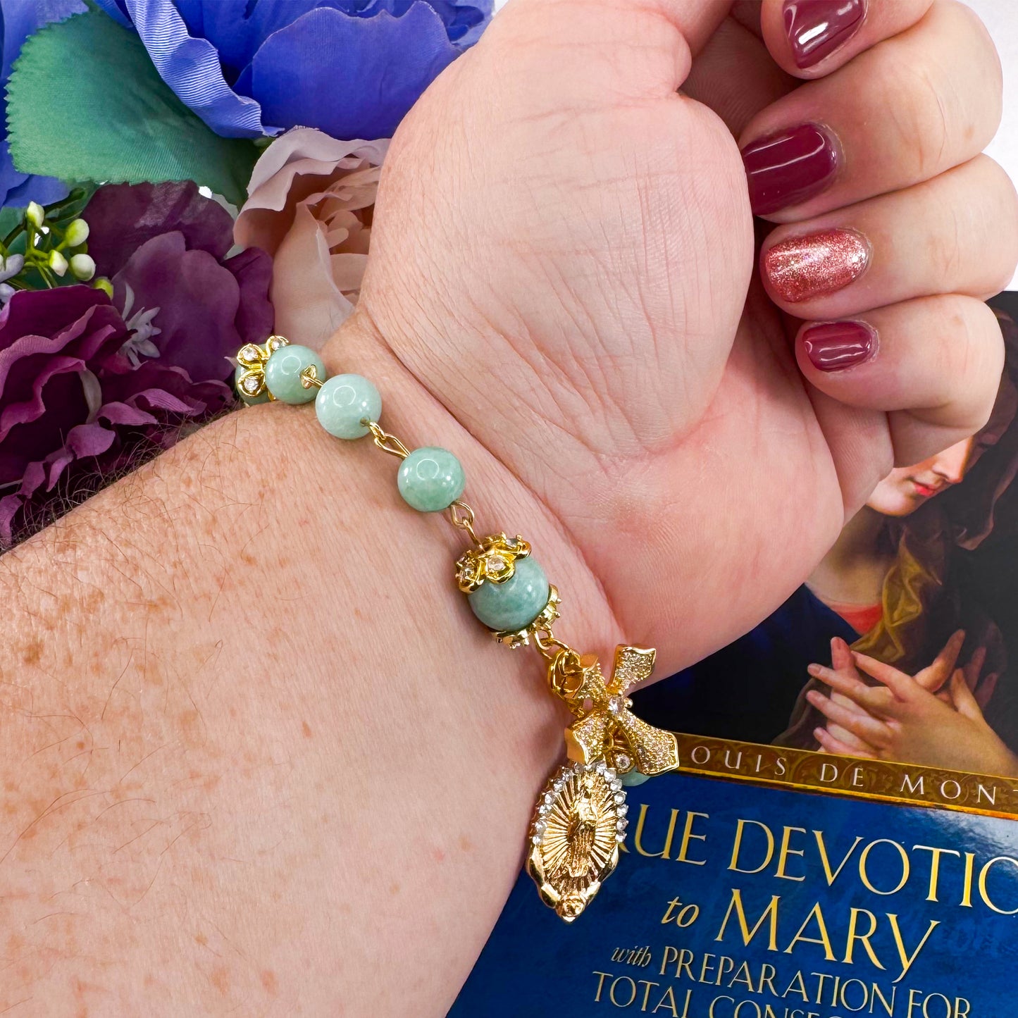 Luxury Catholic rosary bracelet handcrafted with natural Emerald Green Jade gemstone beads, a gold-tone cross with zirconia accents, and a Lady of Guadalupe medal. Adjustable beaded bracelet perfect for prayer, religious gifts, Confirmation, bridesmaid gifts, or everyday devotion. Made in Edmonton, AB, Canada.