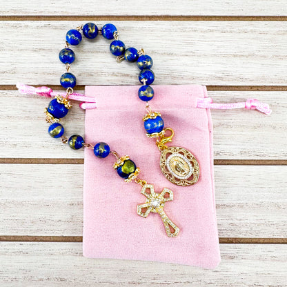 Luxury Catholic rosary bracelet handcrafted with natural Lapis Lazuli gemstone beads, a gold-tone cross with zirconia accents, and a Lady of Guadalupe medal. Adjustable beaded bracelet perfect for prayer, religious gifts, Confirmation, bridesmaid gifts, or everyday devotion. Made in Edmonton, AB, Canada.