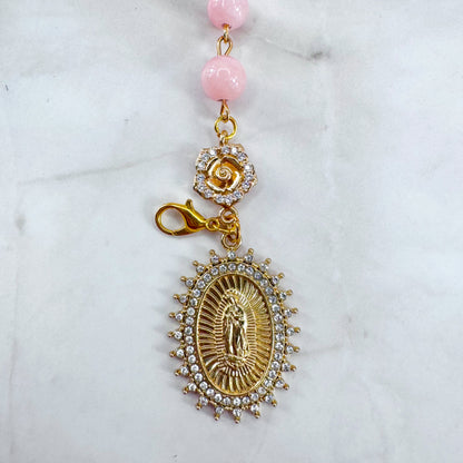 Luxury Catholic rosary bracelet handcrafted with natural rose quartz gemstone beads, a gold-tone cross with zirconia accents, and a Lady of Guadalupe medal. Adjustable beaded bracelet perfect for prayer, religious gifts, Confirmation, bridesmaid gifts, or everyday devotion. Made in Edmonton, AB, Canada.