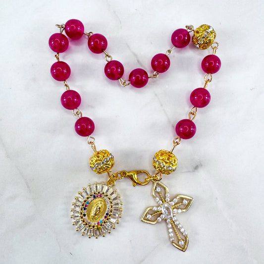 Luxury Catholic rosary bracelet handcrafted with natural Rose Red Chalcedony gemstone beads, a gold-tone cross with zirconia accents, and a Lady of Guadalupe medal. Adjustable beaded bracelet perfect for prayer, religious gifts, Confirmation, bridesmaid gifts, or everyday devotion. Made in Edmonton, AB, Canada.