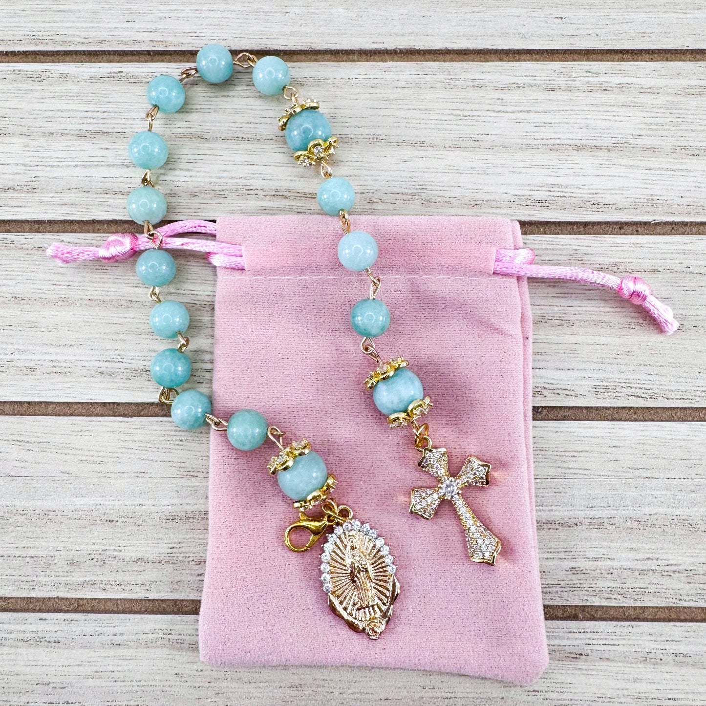 Luxury Catholic rosary bracelet handcrafted with natural Emerald Green Jade gemstone beads, a gold-tone cross with zirconia accents, and a Lady of Guadalupe medal. Adjustable beaded bracelet perfect for prayer, religious gifts, Confirmation, bridesmaid gifts, or everyday devotion. Made in Edmonton, AB, Canada.