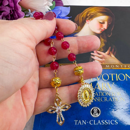 Luxury Catholic rosary bracelet handcrafted with natural Rose Red Chalcedony gemstone beads, a gold-tone cross with zirconia accents, and a Lady of Guadalupe medal. Adjustable beaded bracelet perfect for prayer, religious gifts, Confirmation, bridesmaid gifts, or everyday devotion. Made in Edmonton, AB, Canada.